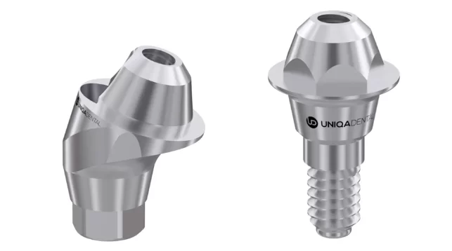 Angled and straight multi-unit abutments, side by side, for connecting dental implants to prostheses.