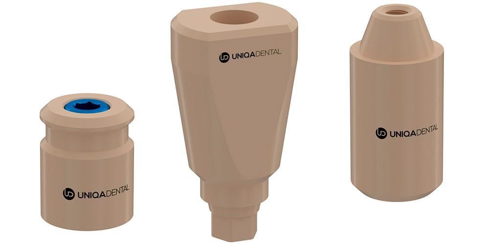 Three beige CAD/CAM dental components Scan Bodies with varying heights and top geometries, intended as bases for dental implants.