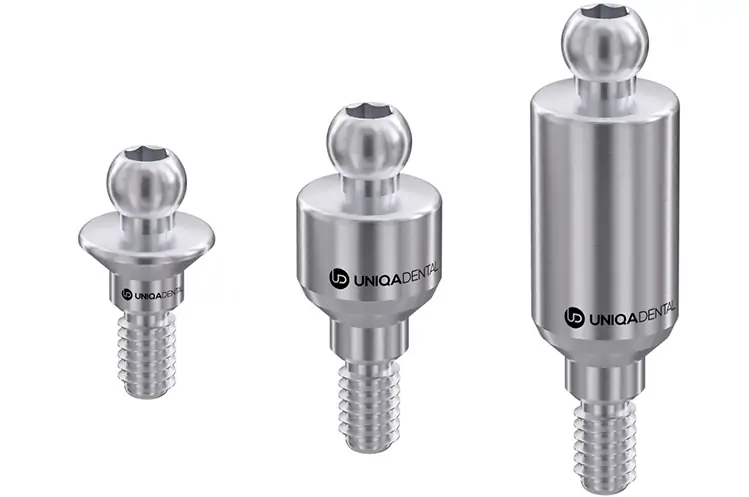 Three different sized dental implant abutments from Uniqa Dental, showcasing the range of options available for customizing implant restorations.